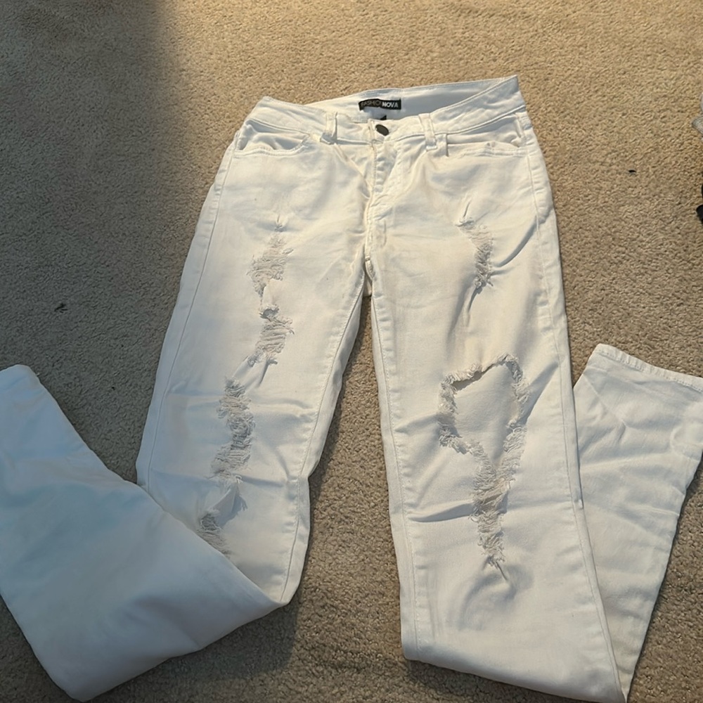Super soft and stretchy white ripped jeans from fashion nova